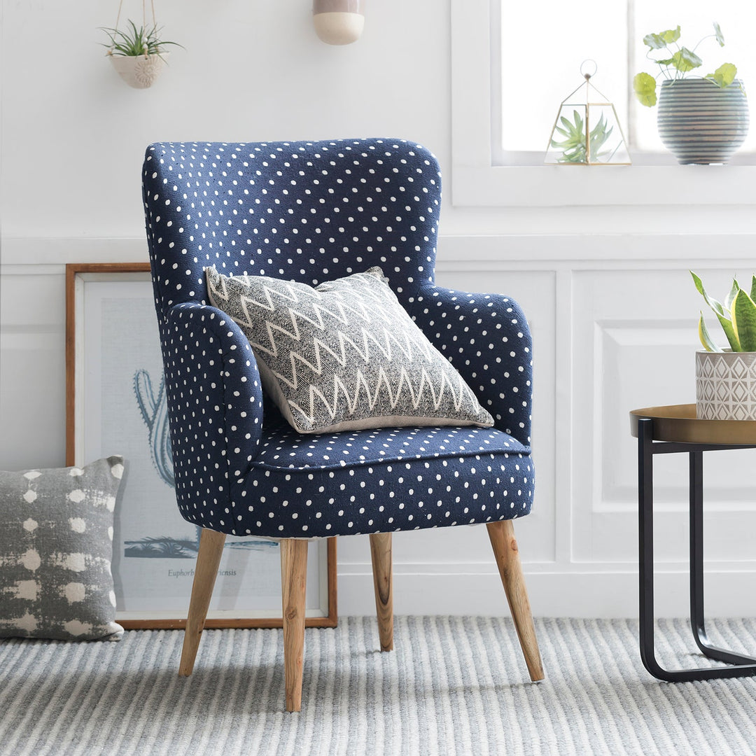 Loft Home modern chair in navy blue polka dot fabric with natural wood legs, perfect for adding a playful and contemporary vibe to any room.