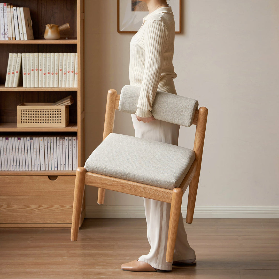 LoftHome Scandinavian chair with a light oak frame and cushioned seat, designed for portability and modern minimalist interiors.