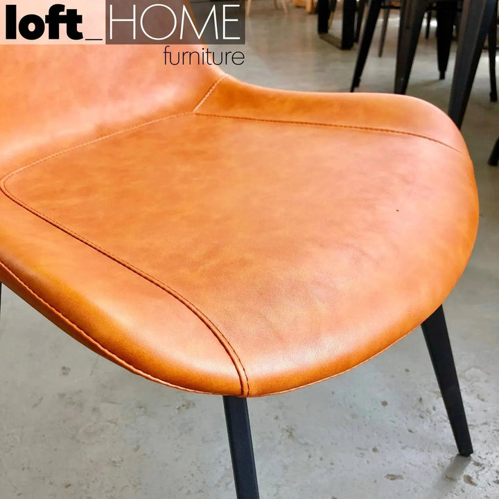 Modern fabric and leather dining chair metal man n1 in close up details.