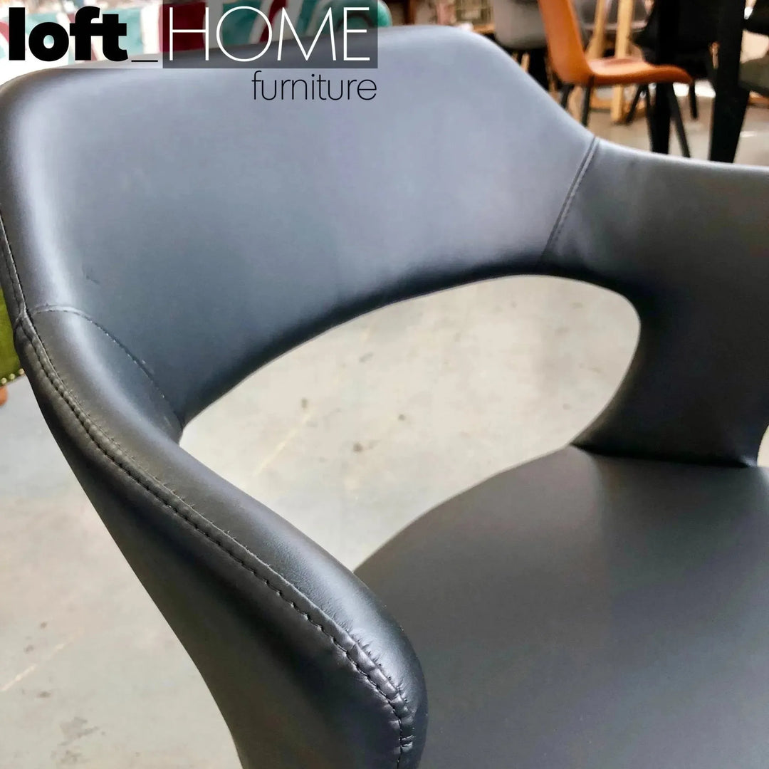 Modern fabric and leather dining chair metal man n2 in close up details.
