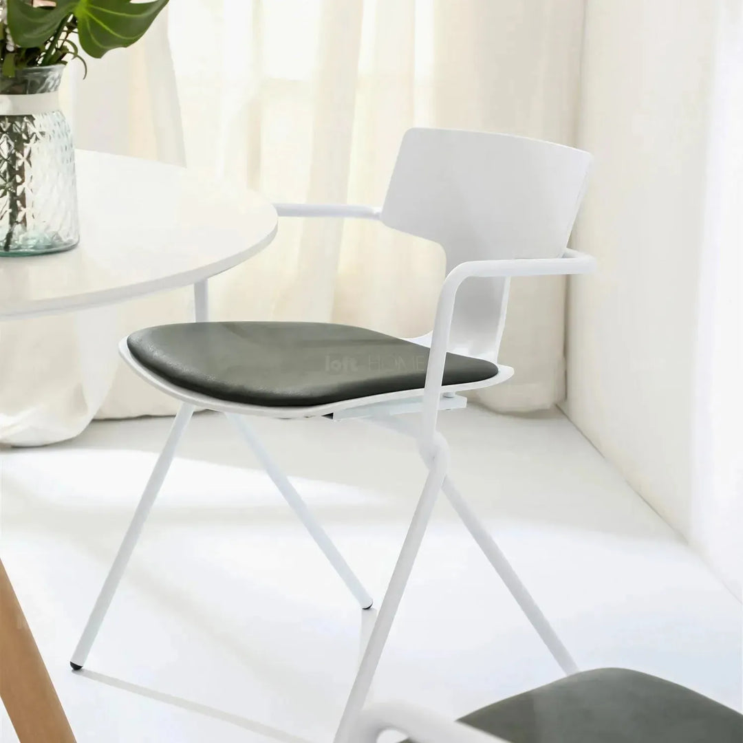 Modern metal dining chair padriac with context.