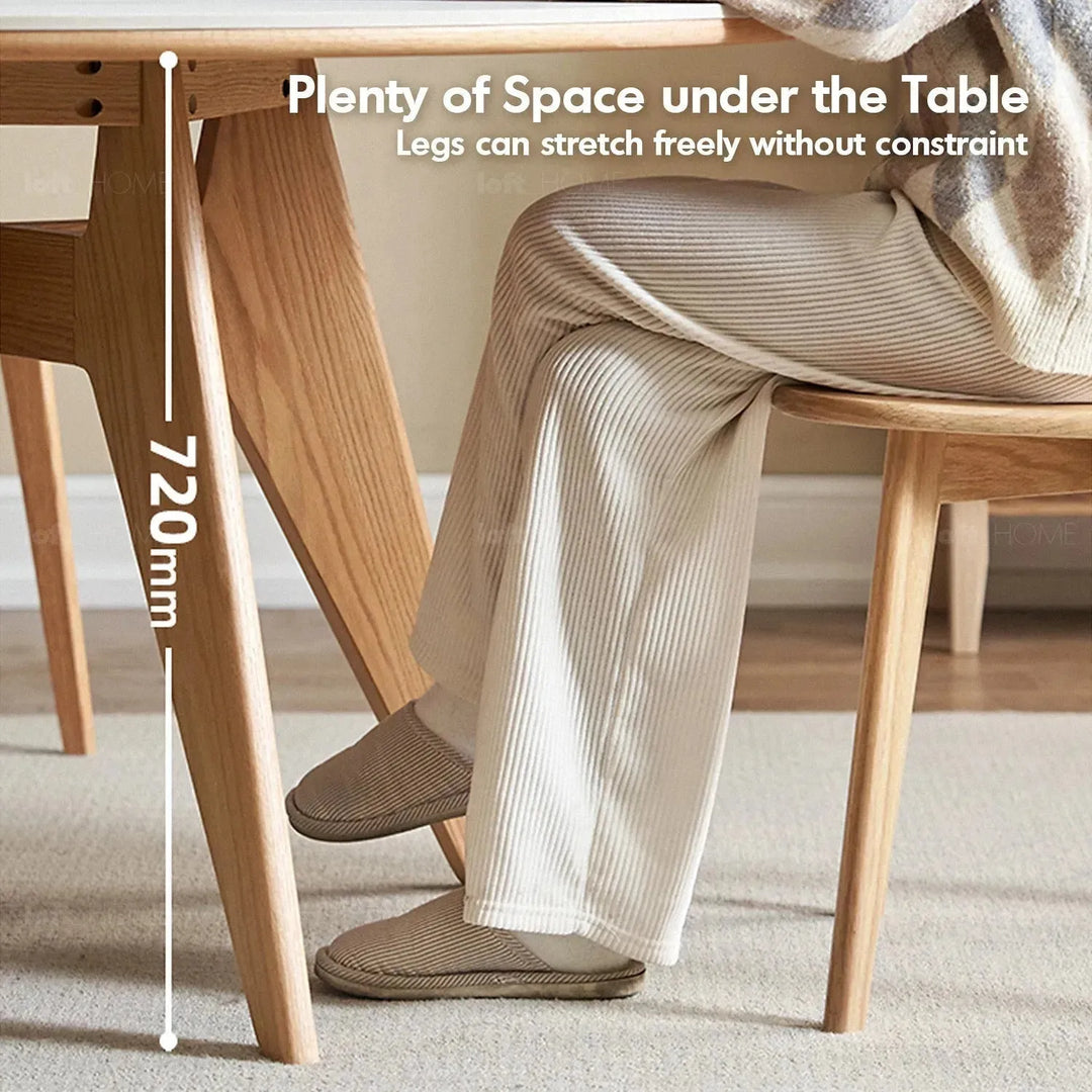 Scandinavian sintered stone round dining table belly in still life.