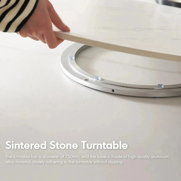 Scandinavian sintered stone round dining table belly with context.