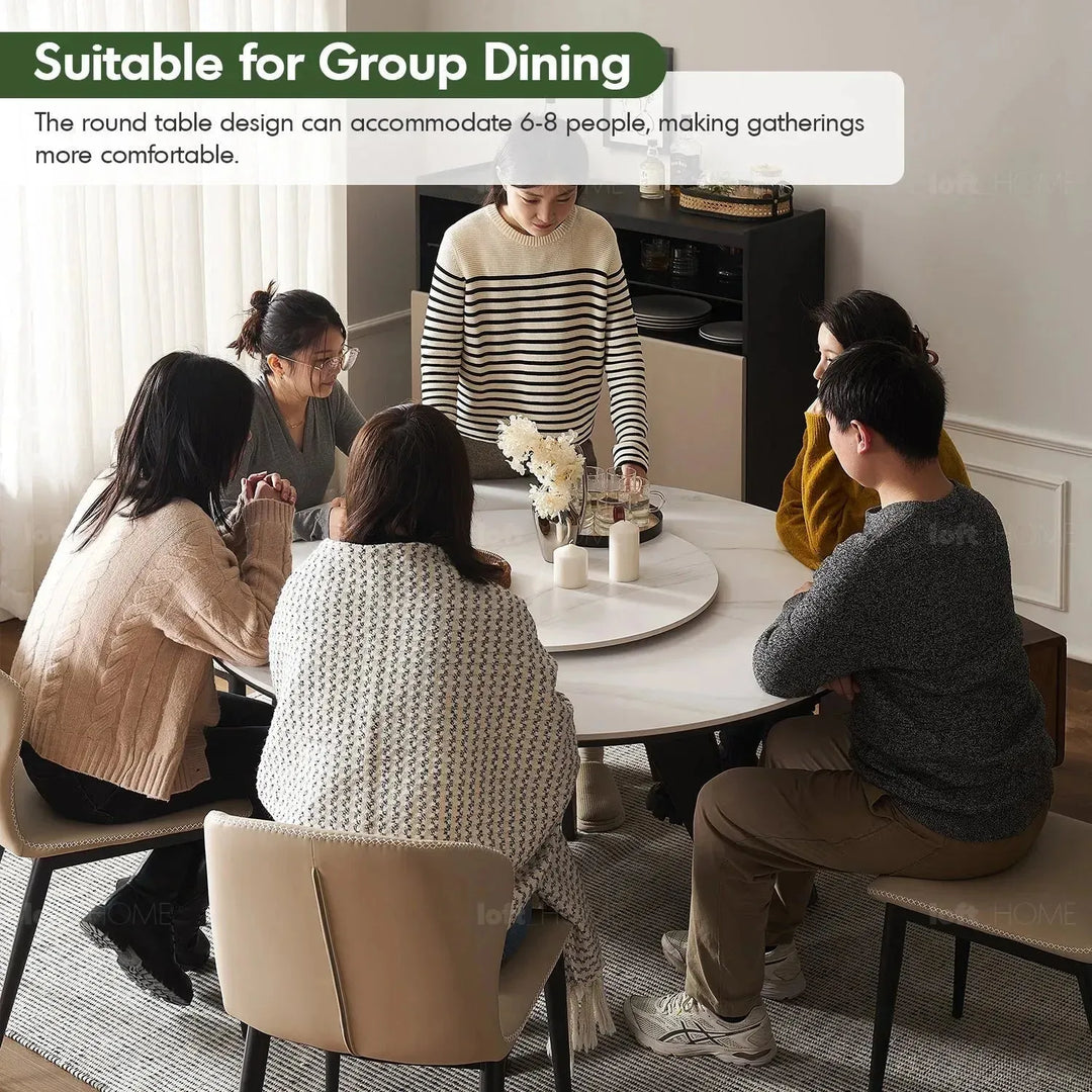 Scandinavian sintered stone round dining table belly in panoramic view.