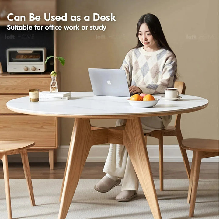 Scandinavian sintered stone round dining table belly in close up details.